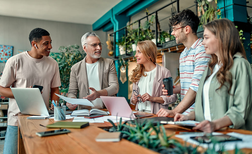 Group of people around table working