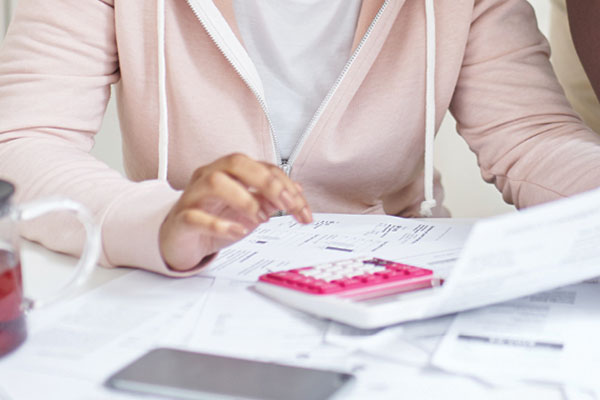 Couple using calculator